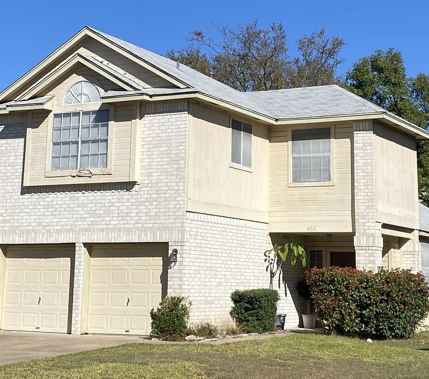 Before the siding & windows project — home exterior in Windermere Phase G, Pflugerville