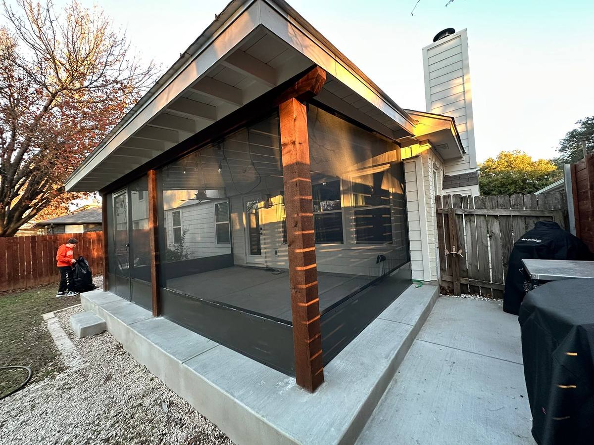 A screened patio cover at golden hour, built by Austin Pro in Shady Hollow, Austin