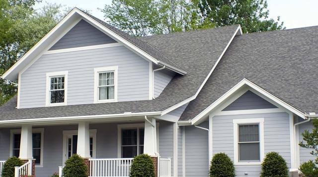 Craftsman home in lavender-gray lap siding with white trim and tapered porch columns, from Sherwin-Williams’ exterior color gallery