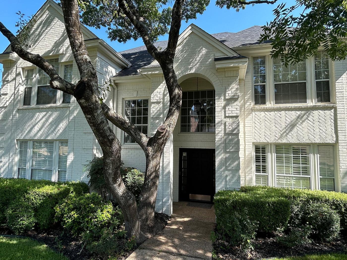 Before the windows & doors project — home exterior in Davenport Ranch, Austin