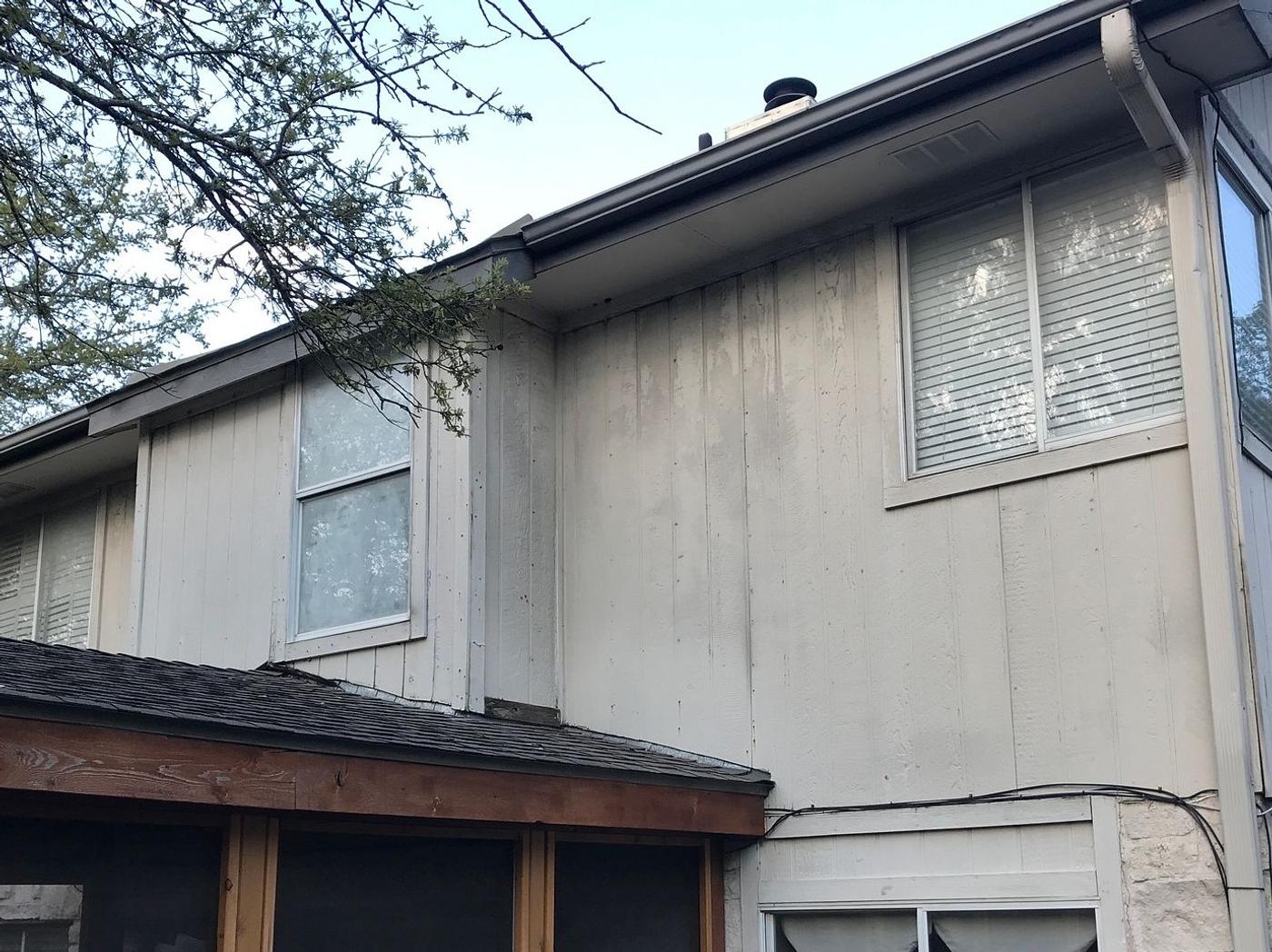 Before the siding & exterior painting project — home exterior in Steiner Ranch, Austin