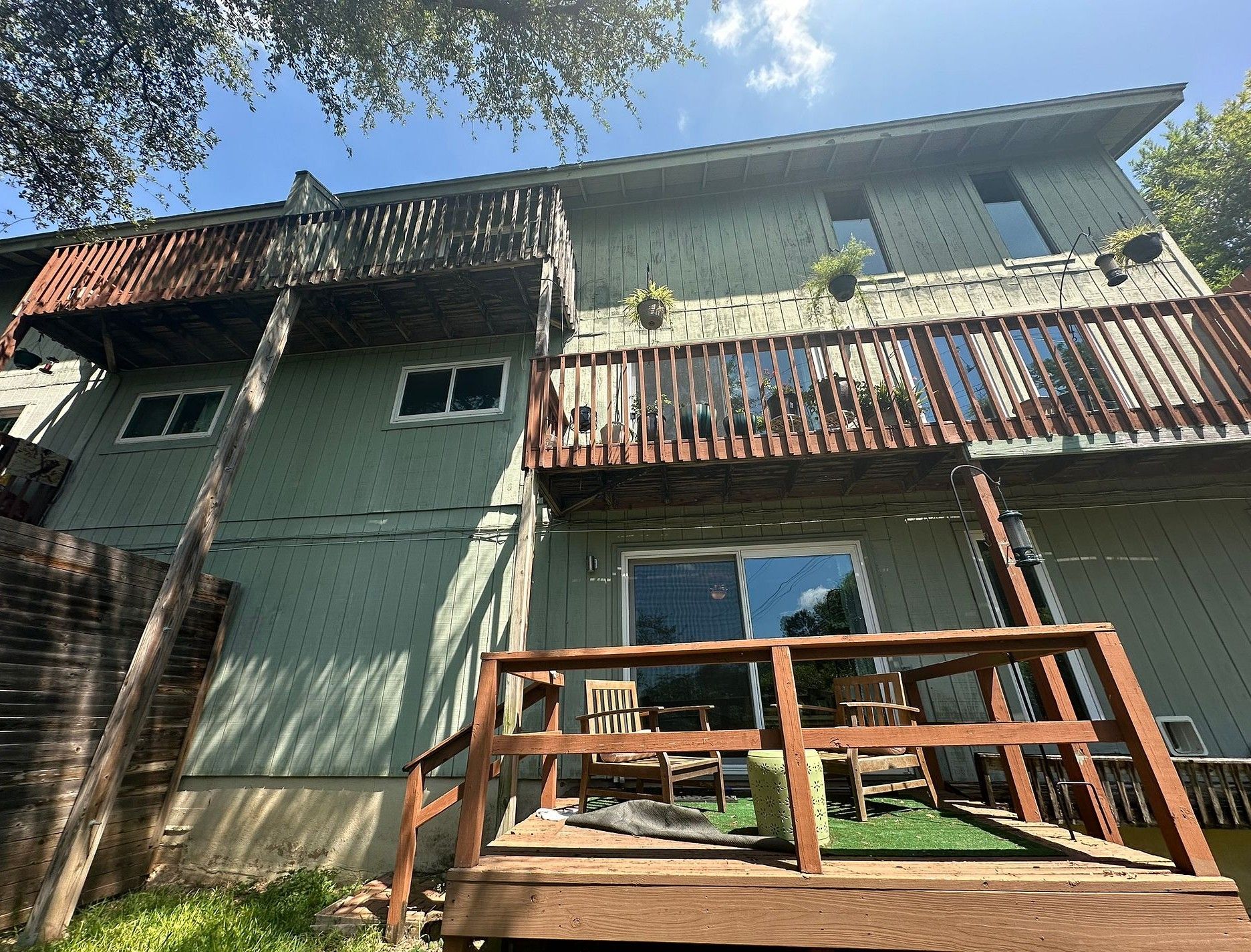 Before the siding & exterior painting project — home exterior in Rockcrest Circle, Austin
