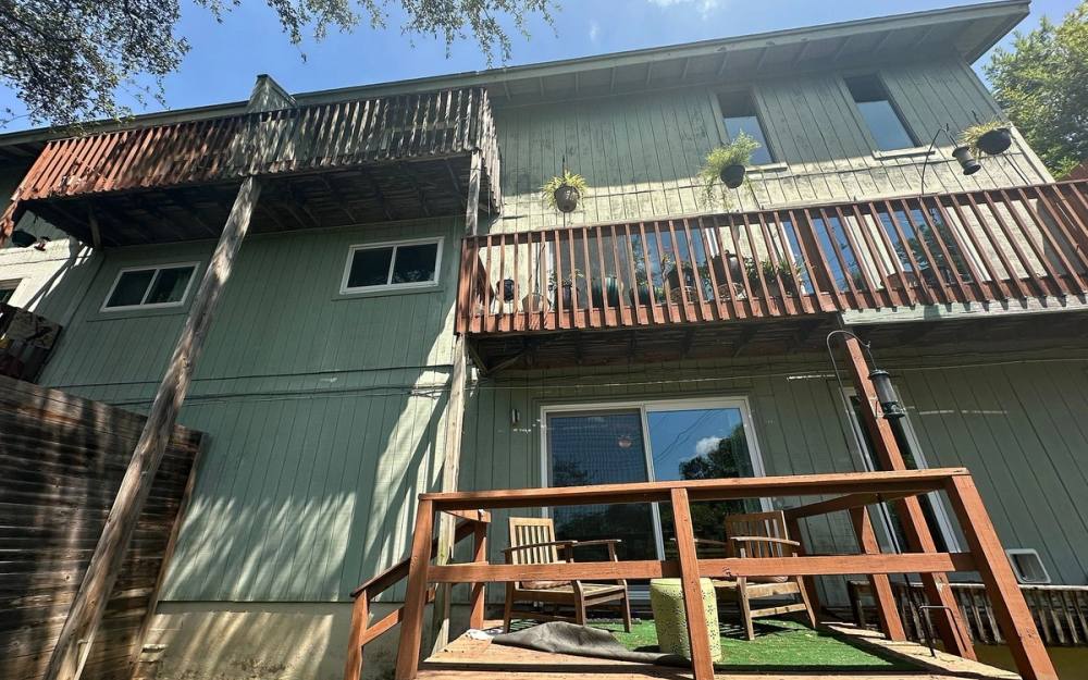 Before the siding & exterior painting project — home exterior in Rockcrest Circle, Austin