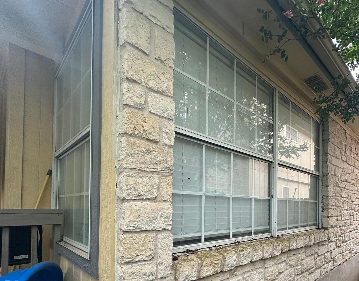 Before the windows project — home exterior in Austin