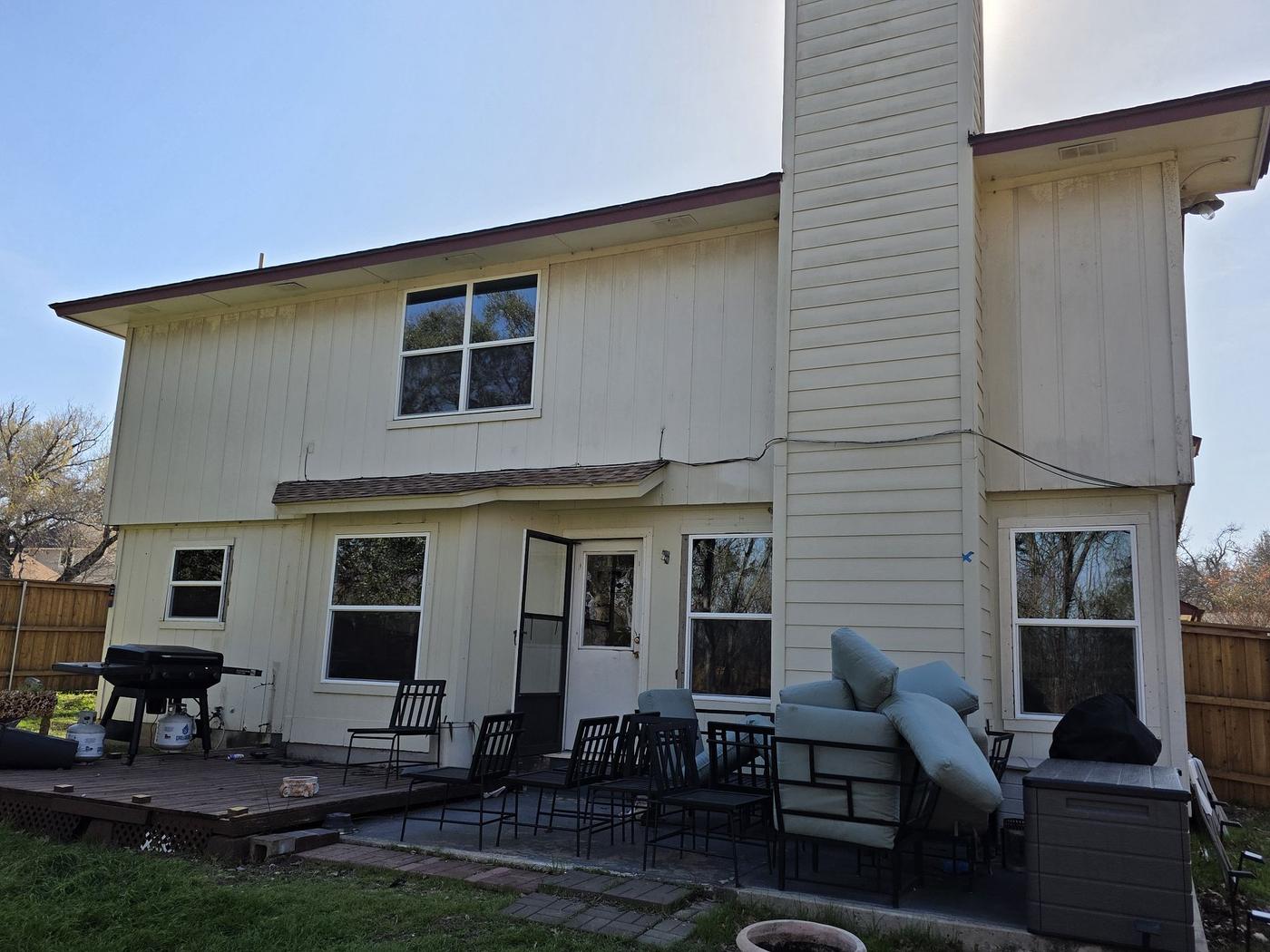 Before the siding & exterior painting project — home exterior in Cherry Creek, Austin