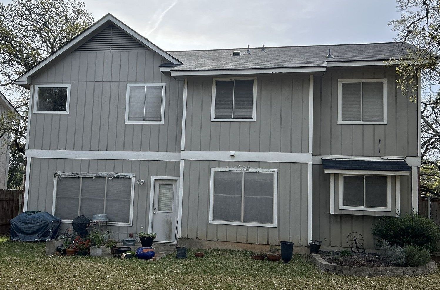 Before the siding & exterior painting project — home exterior in Village At Western Oaks, Austin