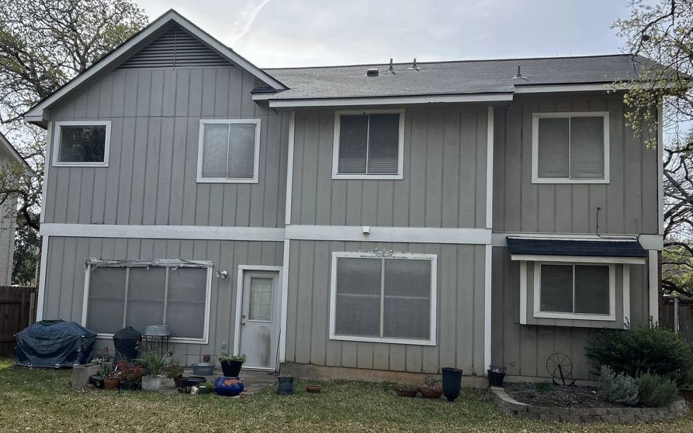 Before the siding & exterior painting project — home exterior in Village At Western Oaks, Austin