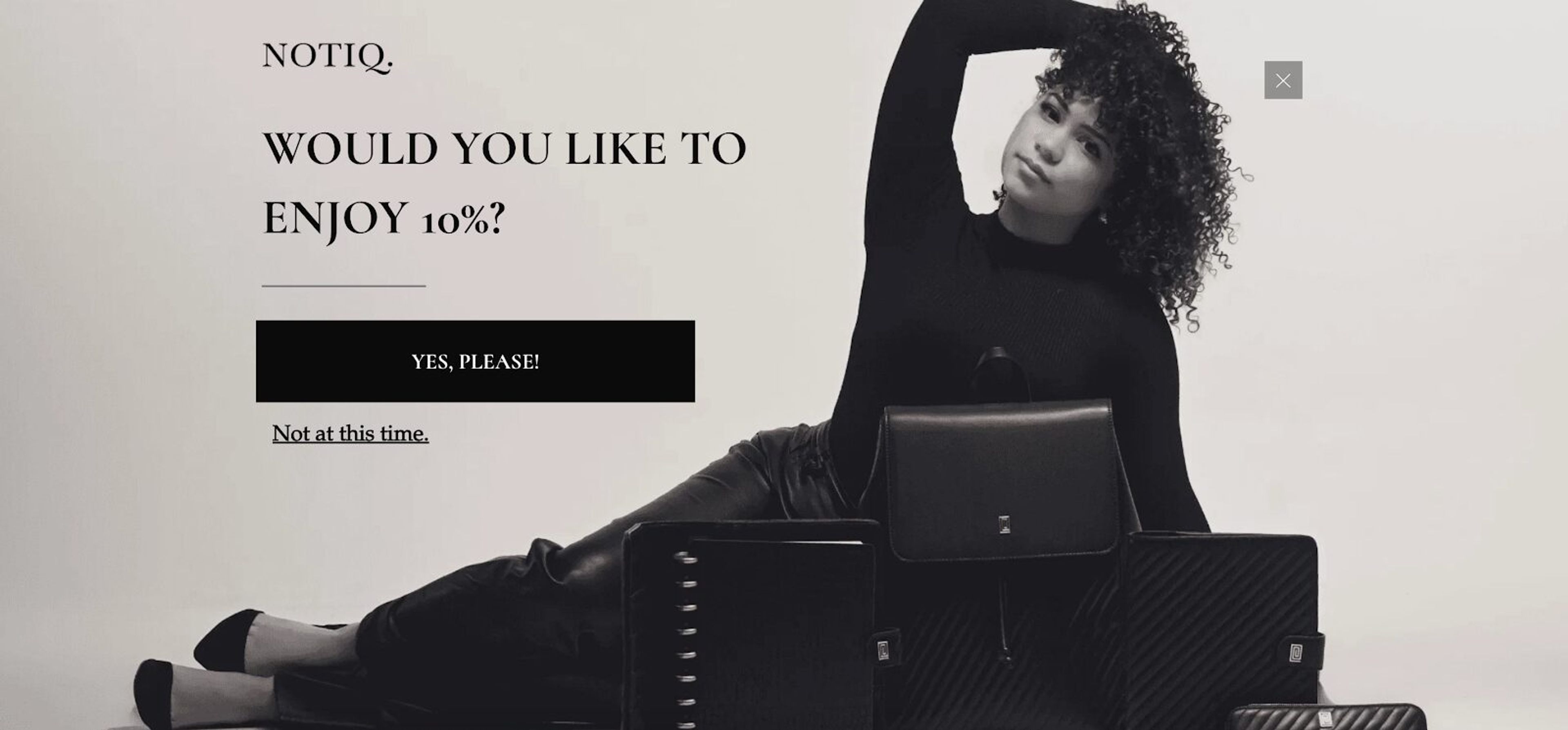 NOTIQ welcome mat popup with black-and-white image and elegant offer to 'Grab 10% Off.