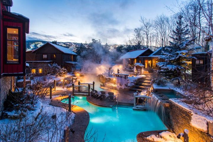 Scenic view of an outdoor pool in winter at night