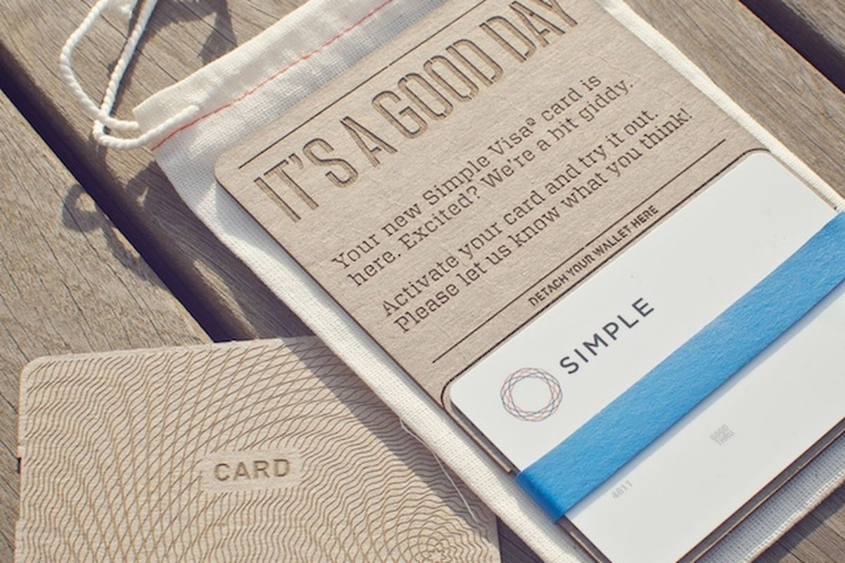 Image of wood engraved cardholders Simple sends to their customers upon signing up.