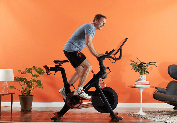 Image of man on peloton exercise bike.
