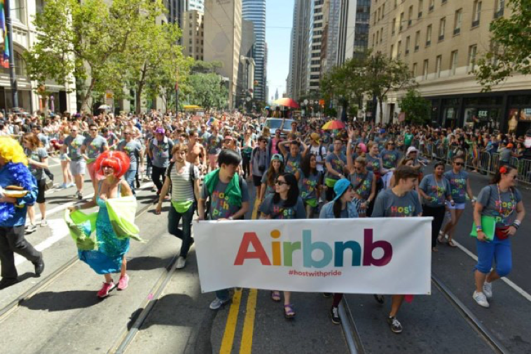 Image of AirBnB marching at the Pride parade.
