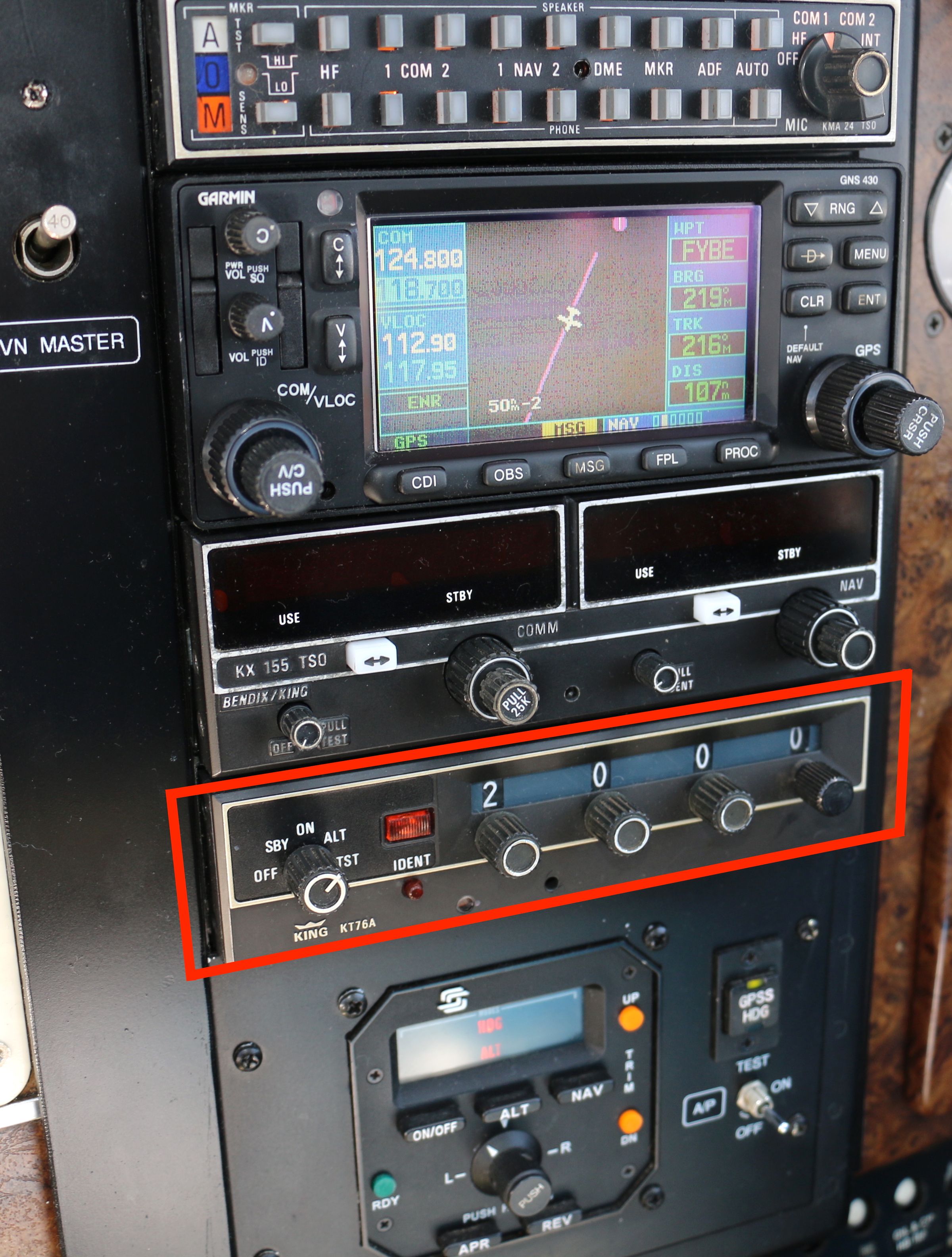 A Mode S transponder unit in the cockpit of a private Beechcraft, its display showing the squawk code 2000. The transponder is the hardware that broadcasts an aircraft's ADS-B Out position and identity on 1090 MHz.