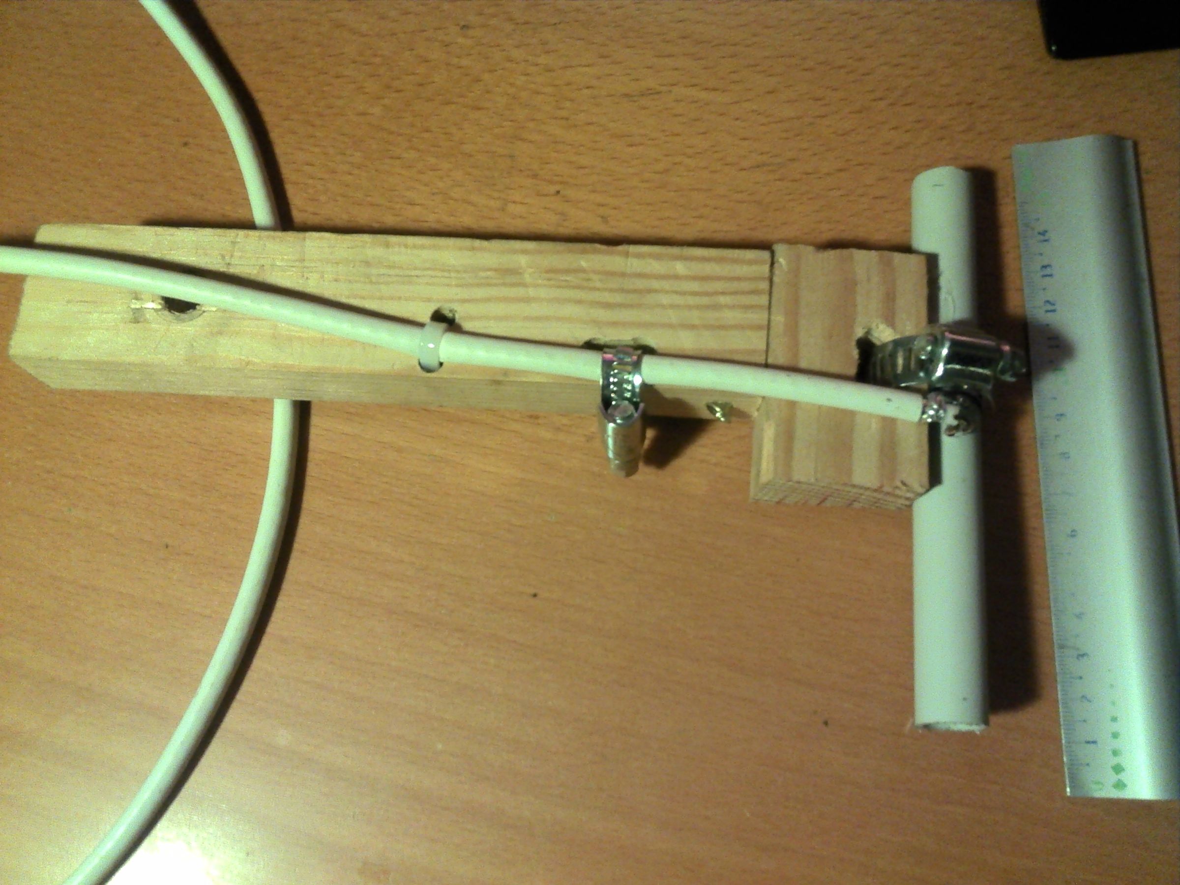 A homemade 1090 MHz dipole antenna of the kind hobbyists build to receive ADS-B broadcasts. Thousands of these volunteer-run receivers feed the public flight-tracking networks.