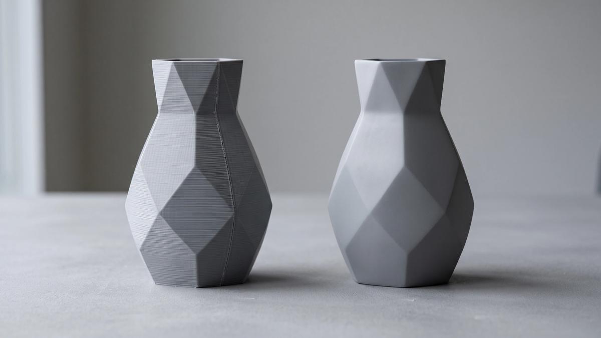 The same 3D printed vase shown twice, one with visible layer lines and one sanded and primed to a smooth finish