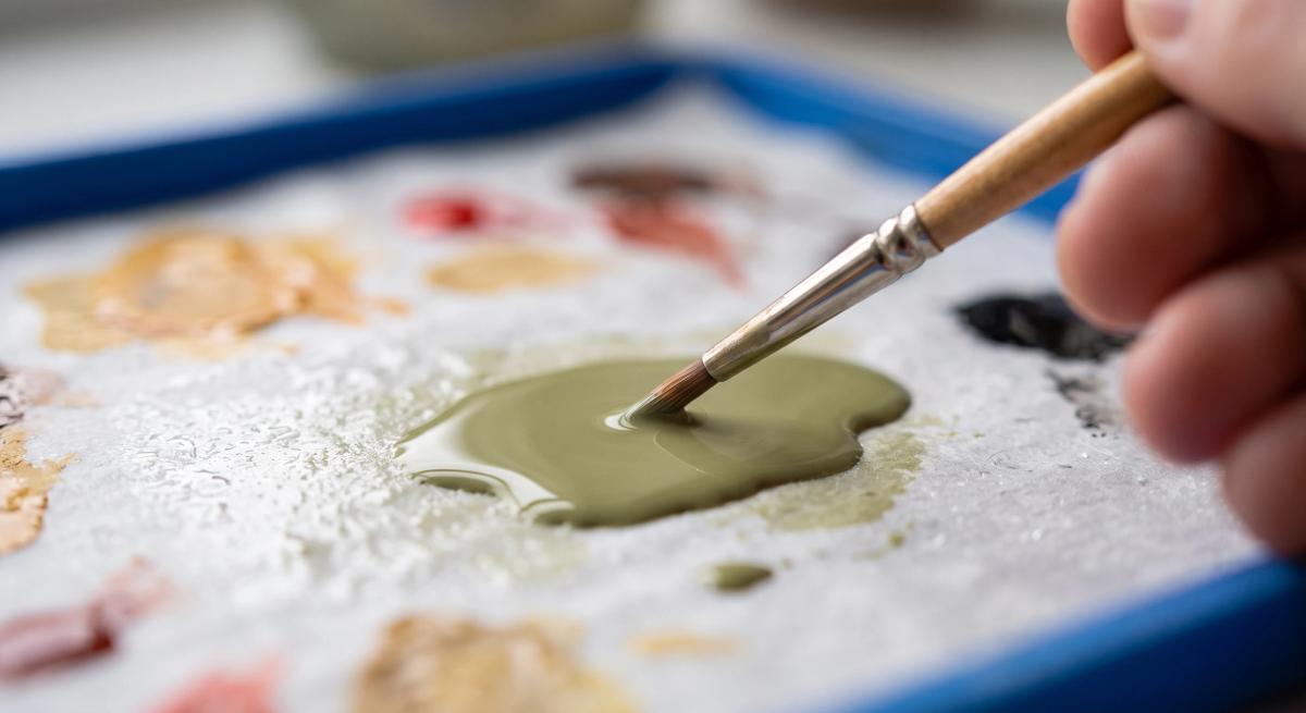 Acrylic paint thinned to a milky consistency on a wet palette with a detail brush
