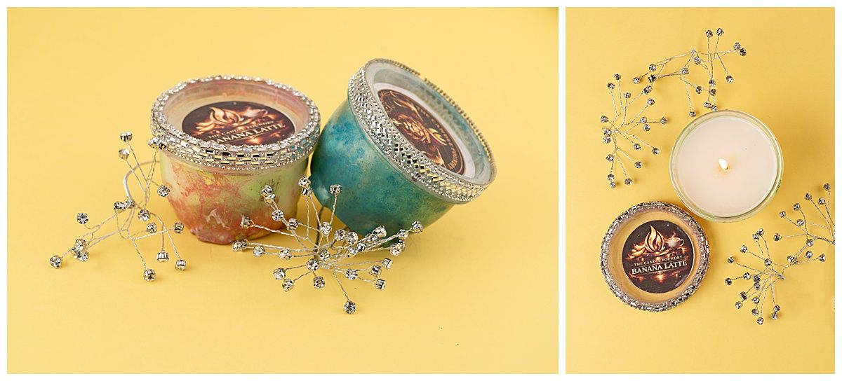 Colorful indie made candles on a yellow background with sparkly props to compliment the product.