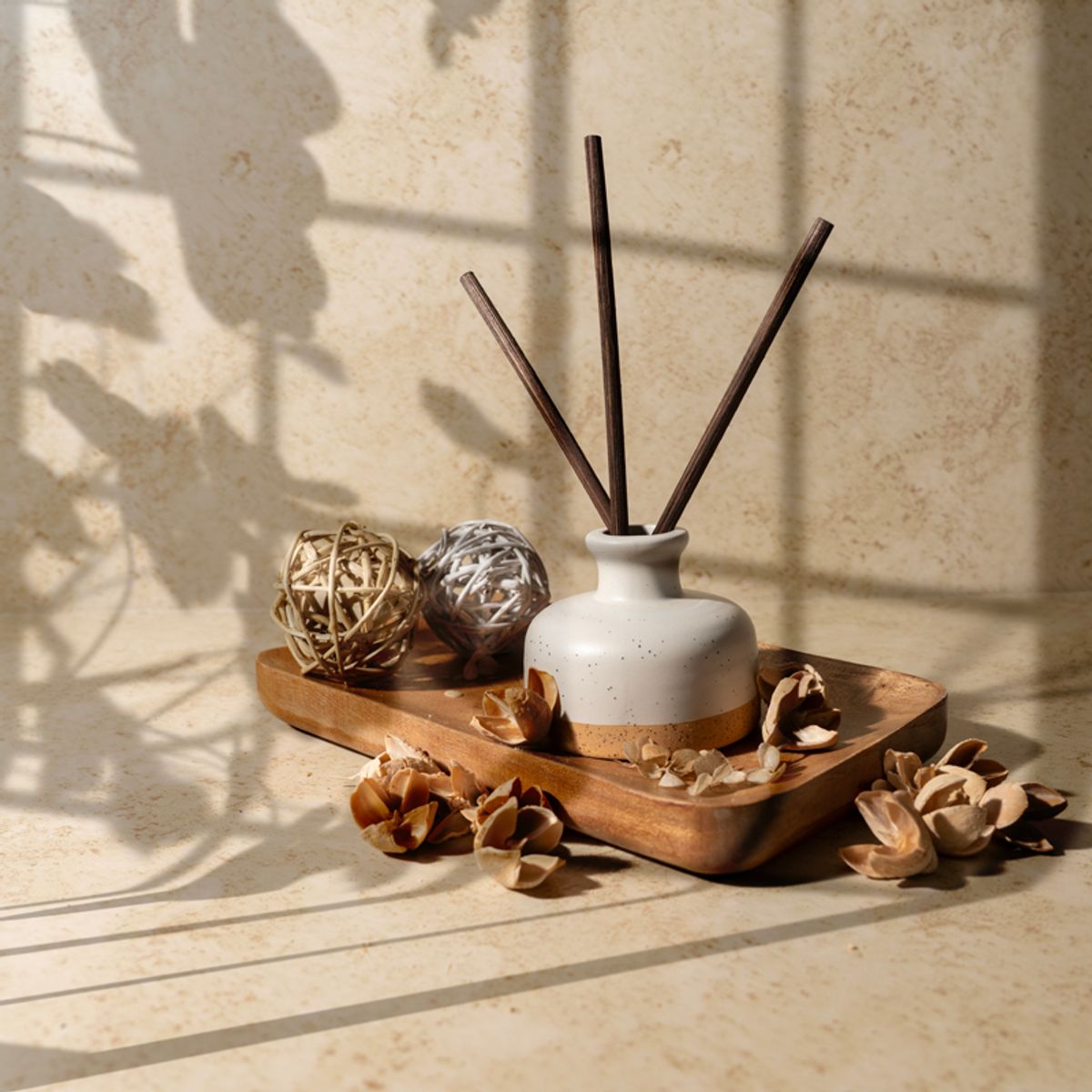 diffuser product photo on a warm background with sun drenched shadows
