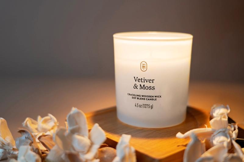 one white decorative votive candle in a product photography image