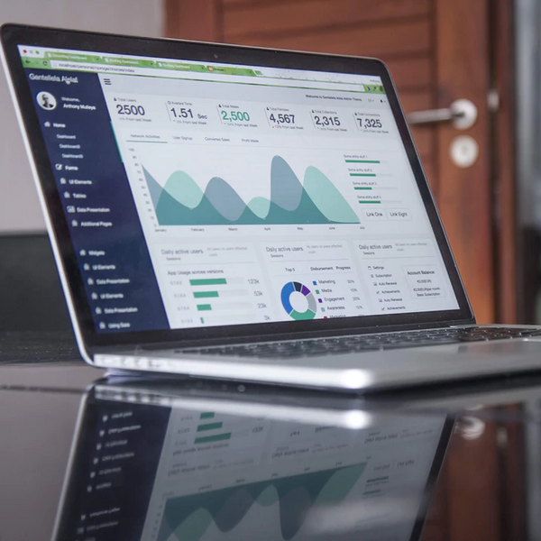 laptop showing a dashboard on the screen