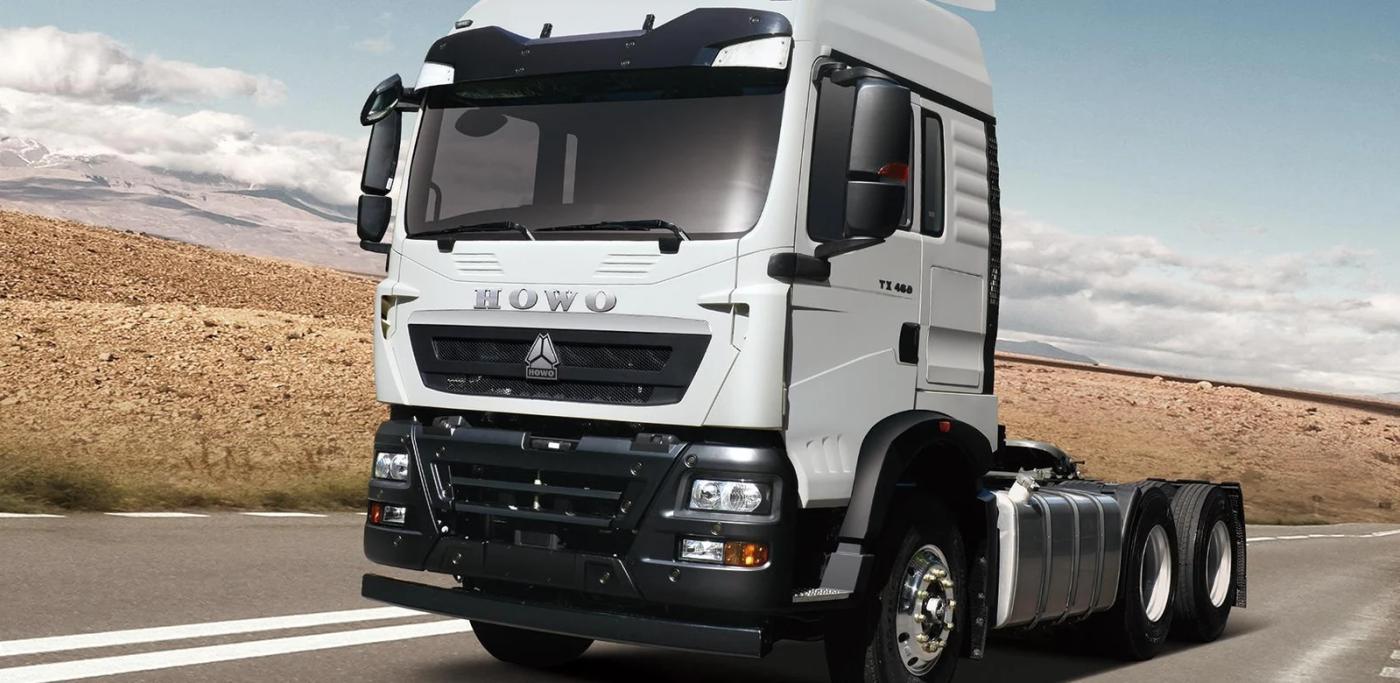 HOWO-TX 6×4 tractor unit illustrated on a highway