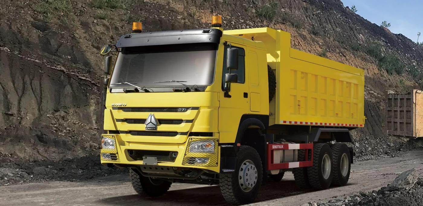 Yellow HOWO-7 6×4 tipper illustrated at a quarry