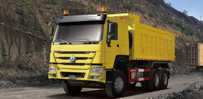 Yellow HOWO-7 6×4 tipper illustrated at a quarry