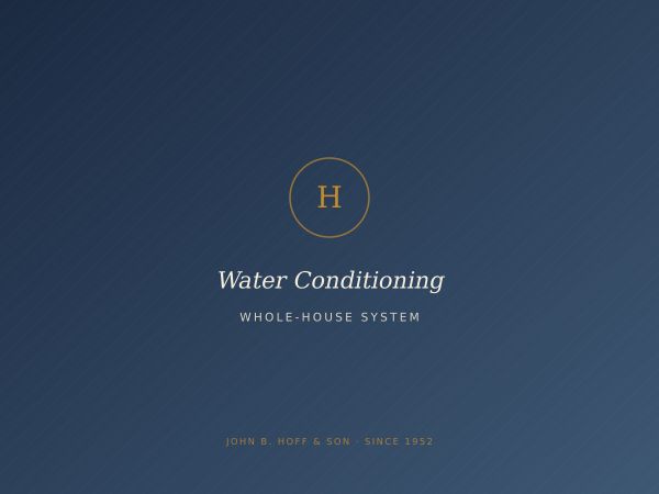 A whole-house water softener and filtration tank in a utility room