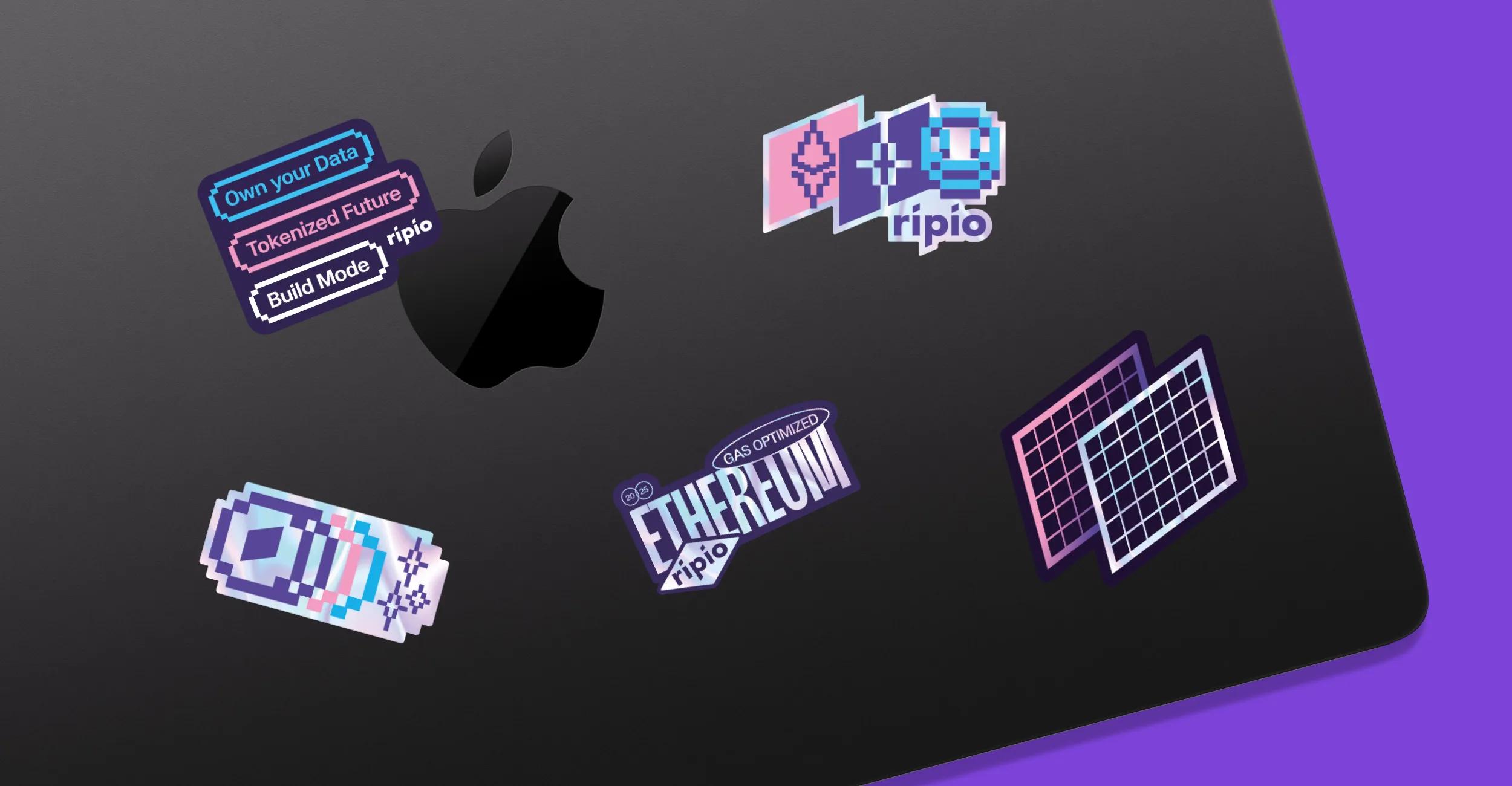 Laptop with Ripio and Ethereum-inspired stickers representing brand universe