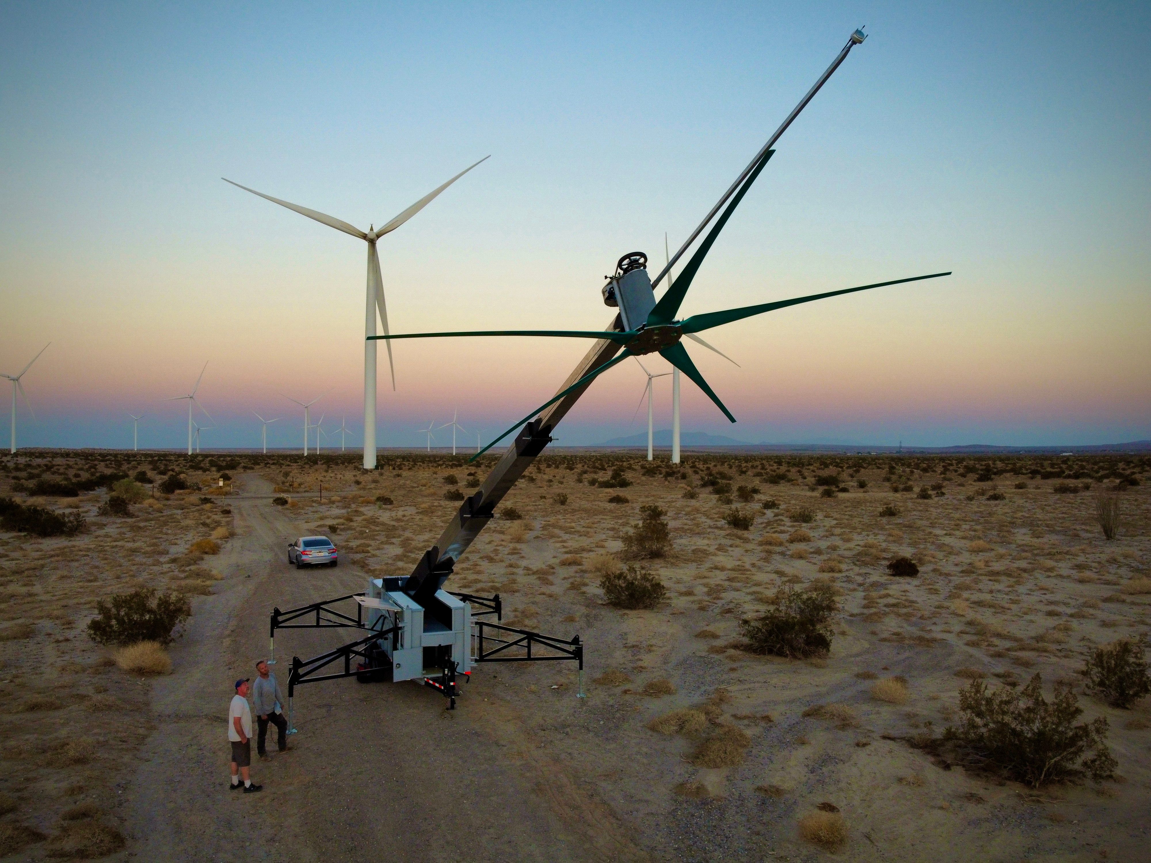 Uprise mobile turbine next to traditional turbine