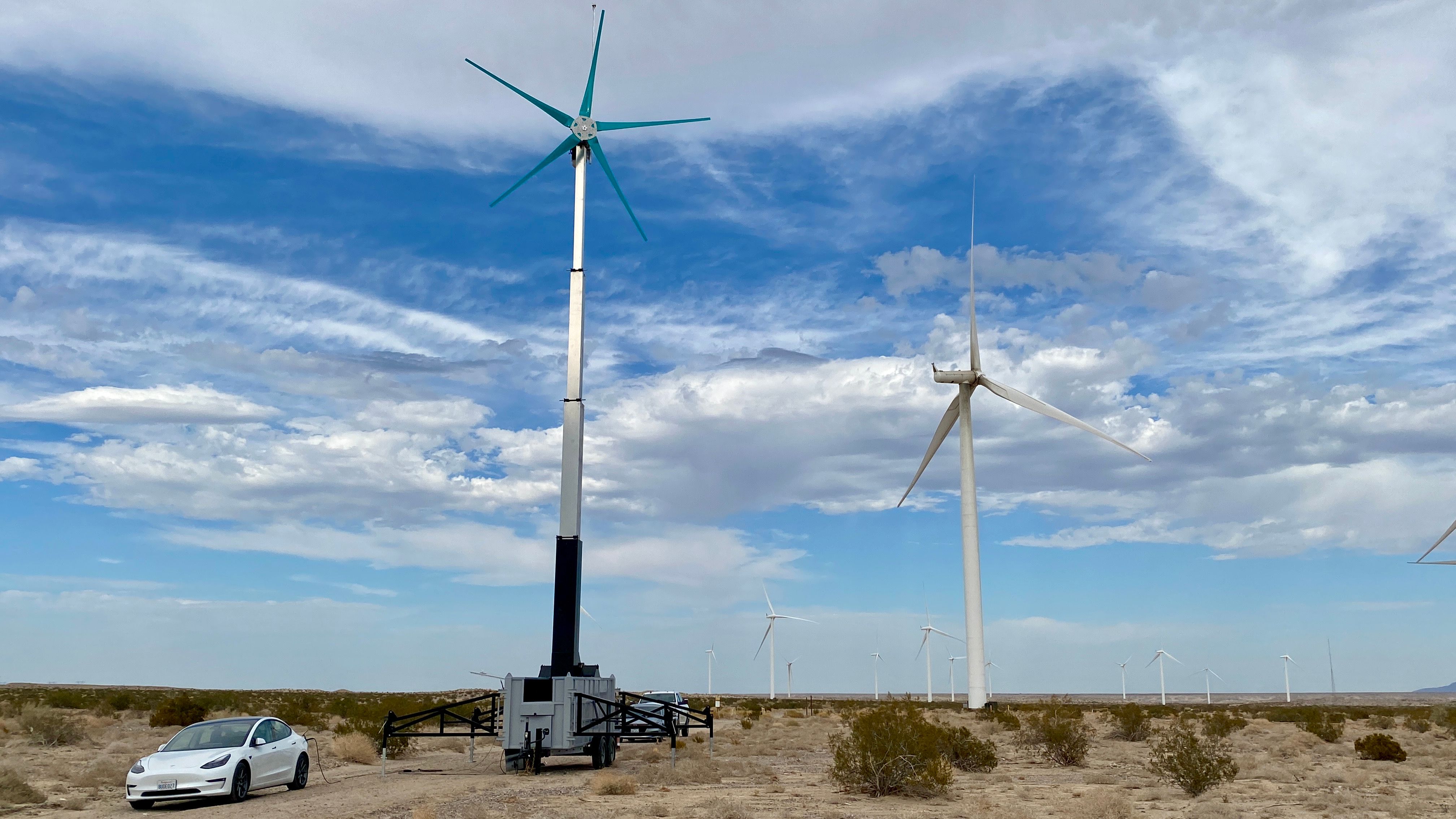 Uprise mobile turbine next to traditional turbine
