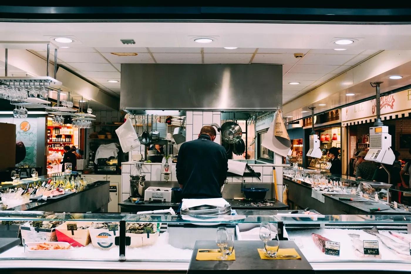 Chef working in a busy open commercial kitchen