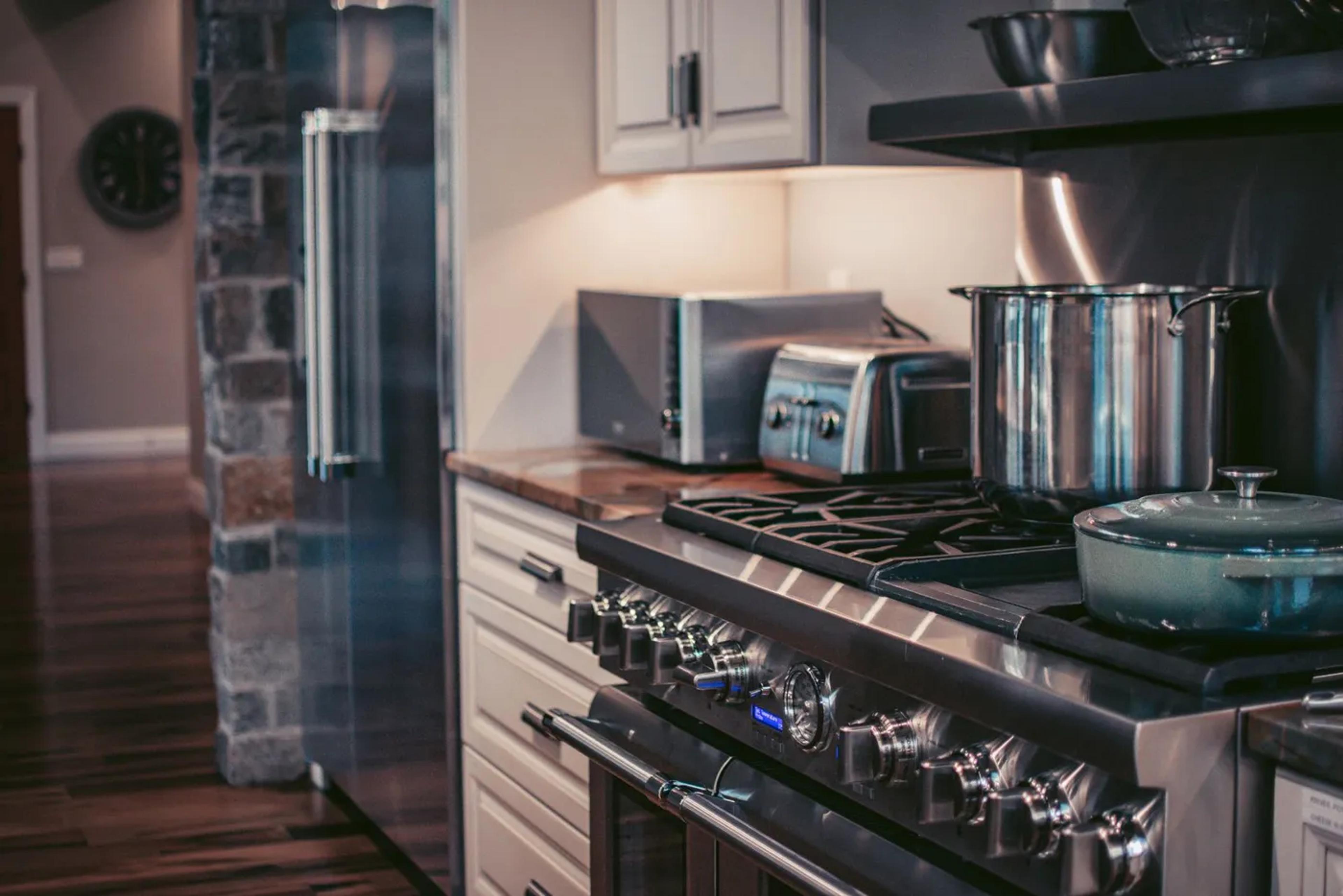 Kitchen with a professional-style gas range and stainless steel appliances