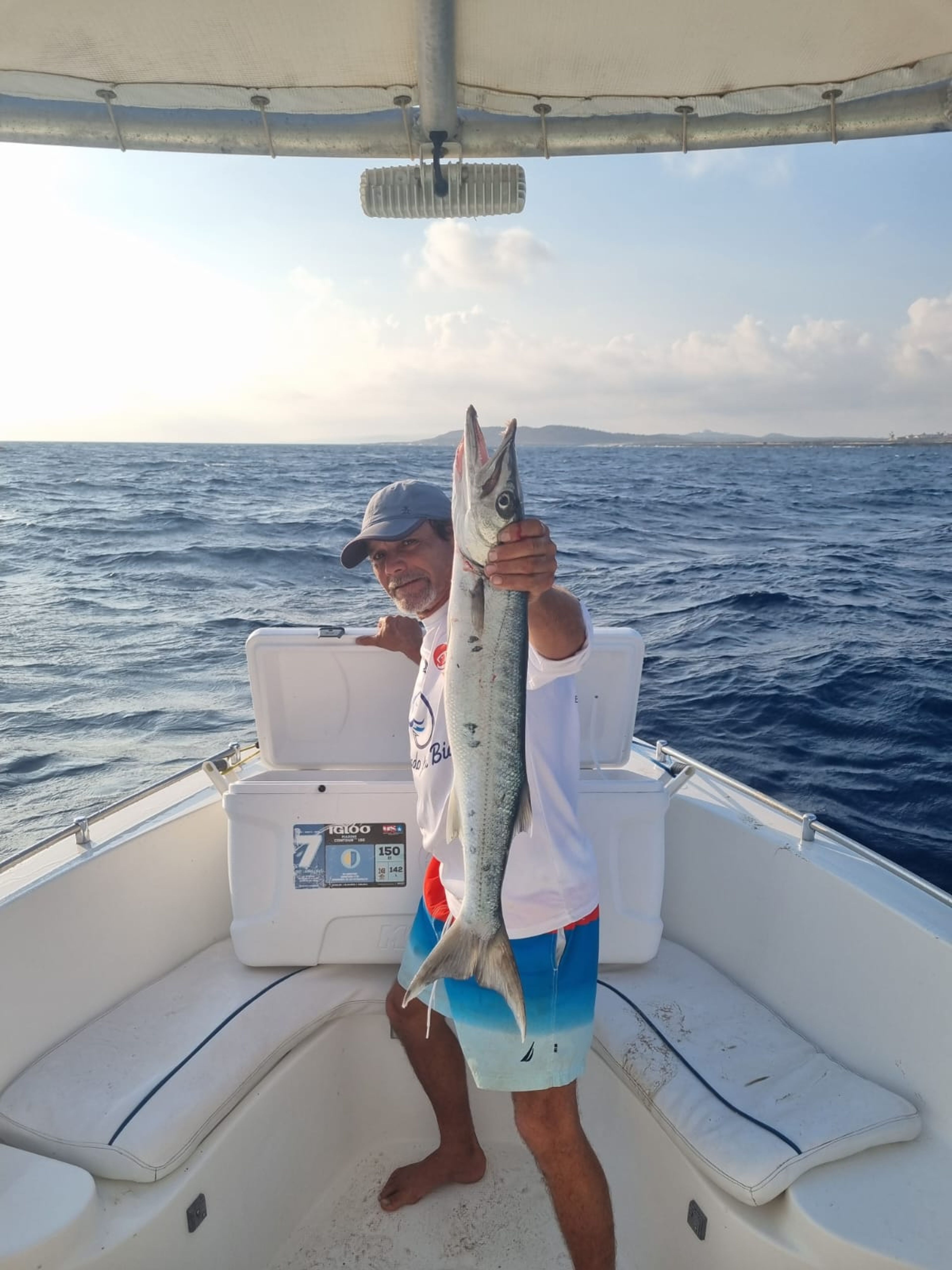 Fisherman holding fish