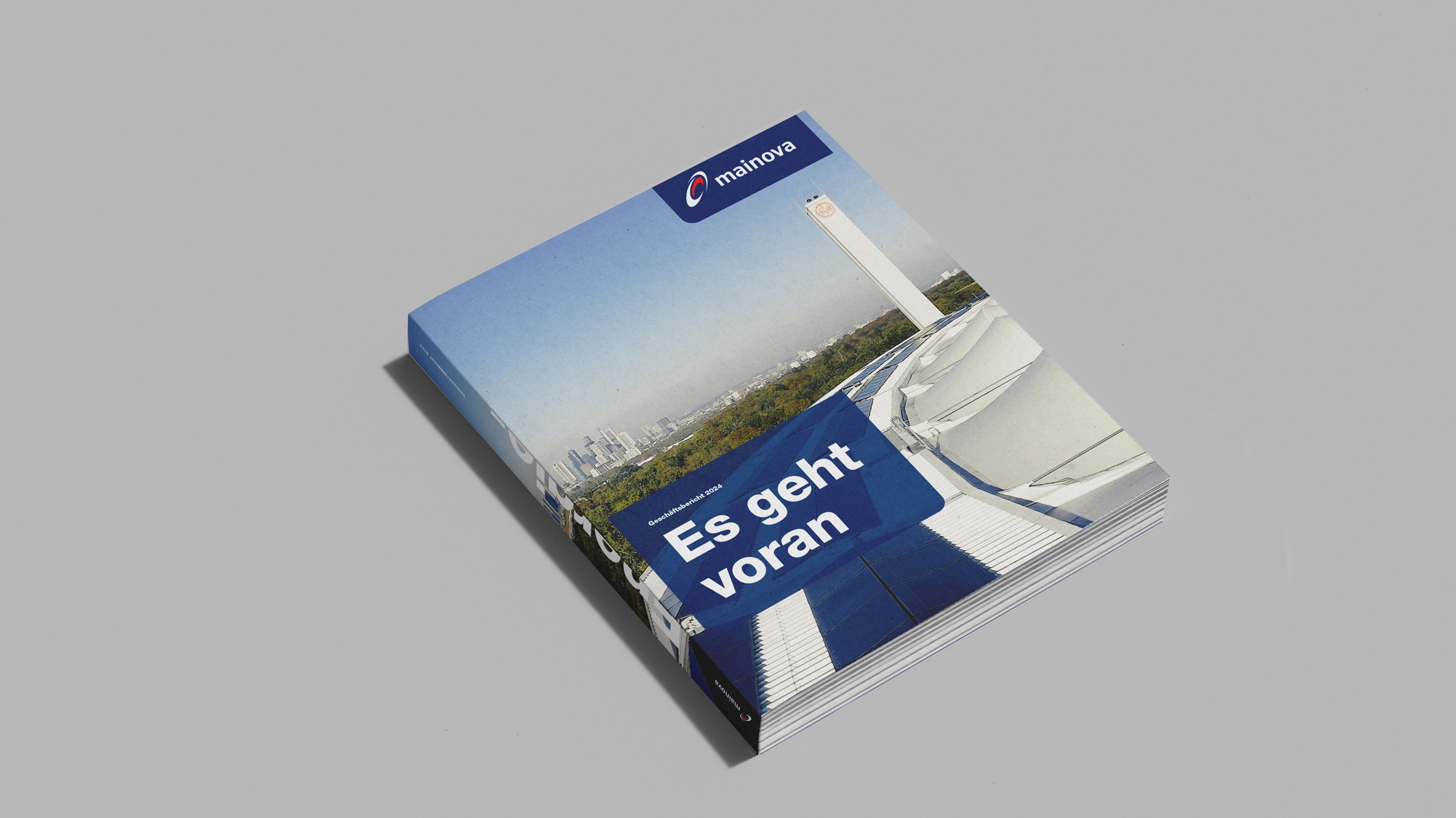 Foto des Geschäftsberichts auf grauem Untergrund