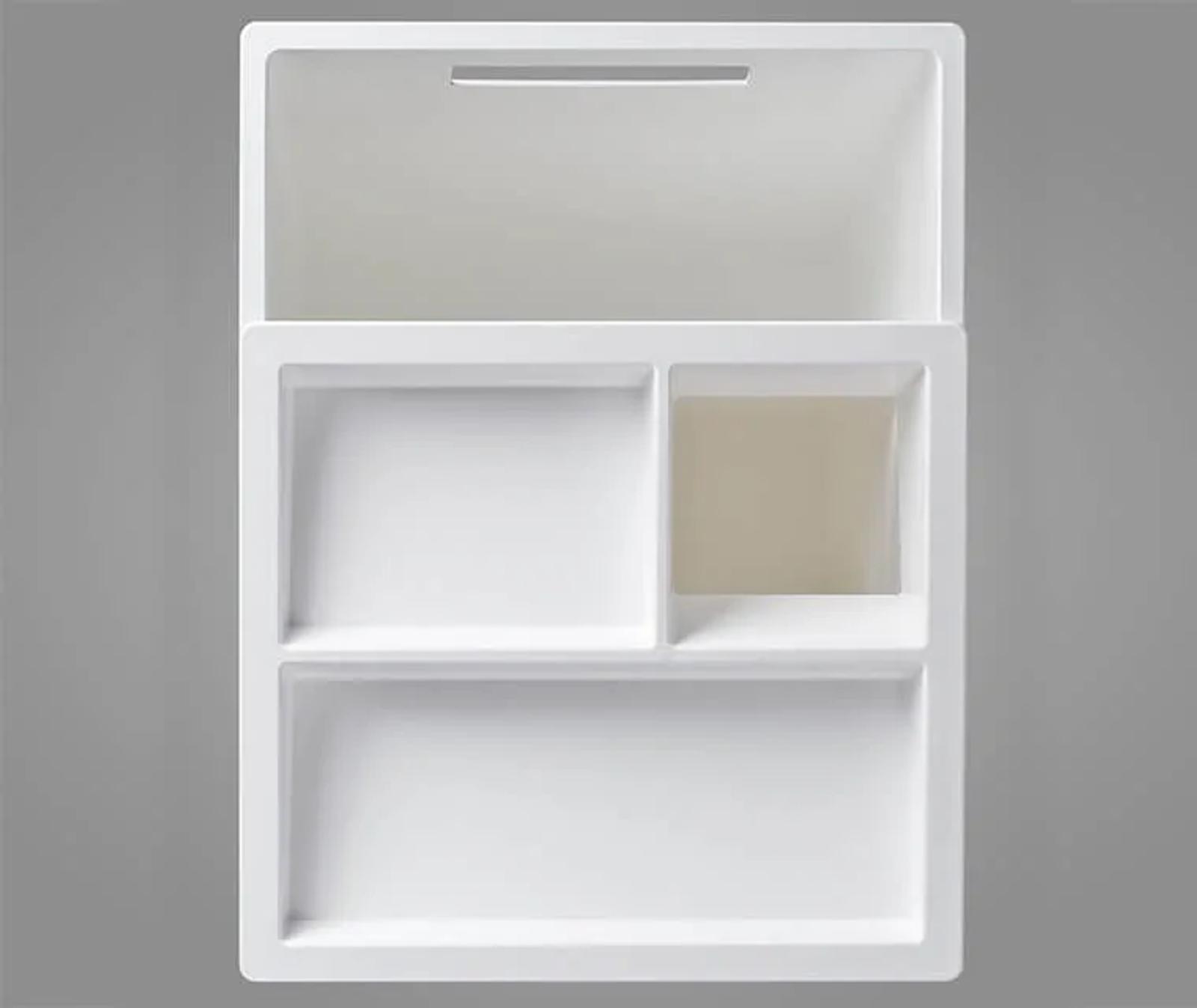 The top with its ergonomic sliding opening conceals two removable compartments and can at the same time also be used as a tray for small objects.