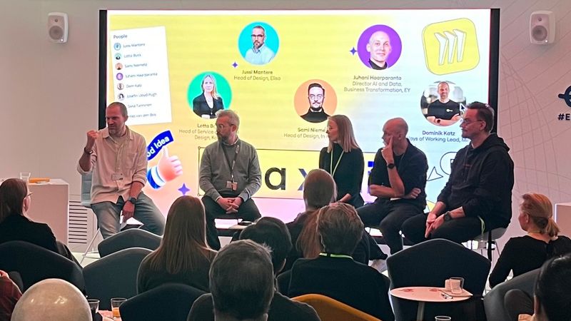 Dom from Miro, Jussi, Lotta, Juhani and Sami engage in discussion.