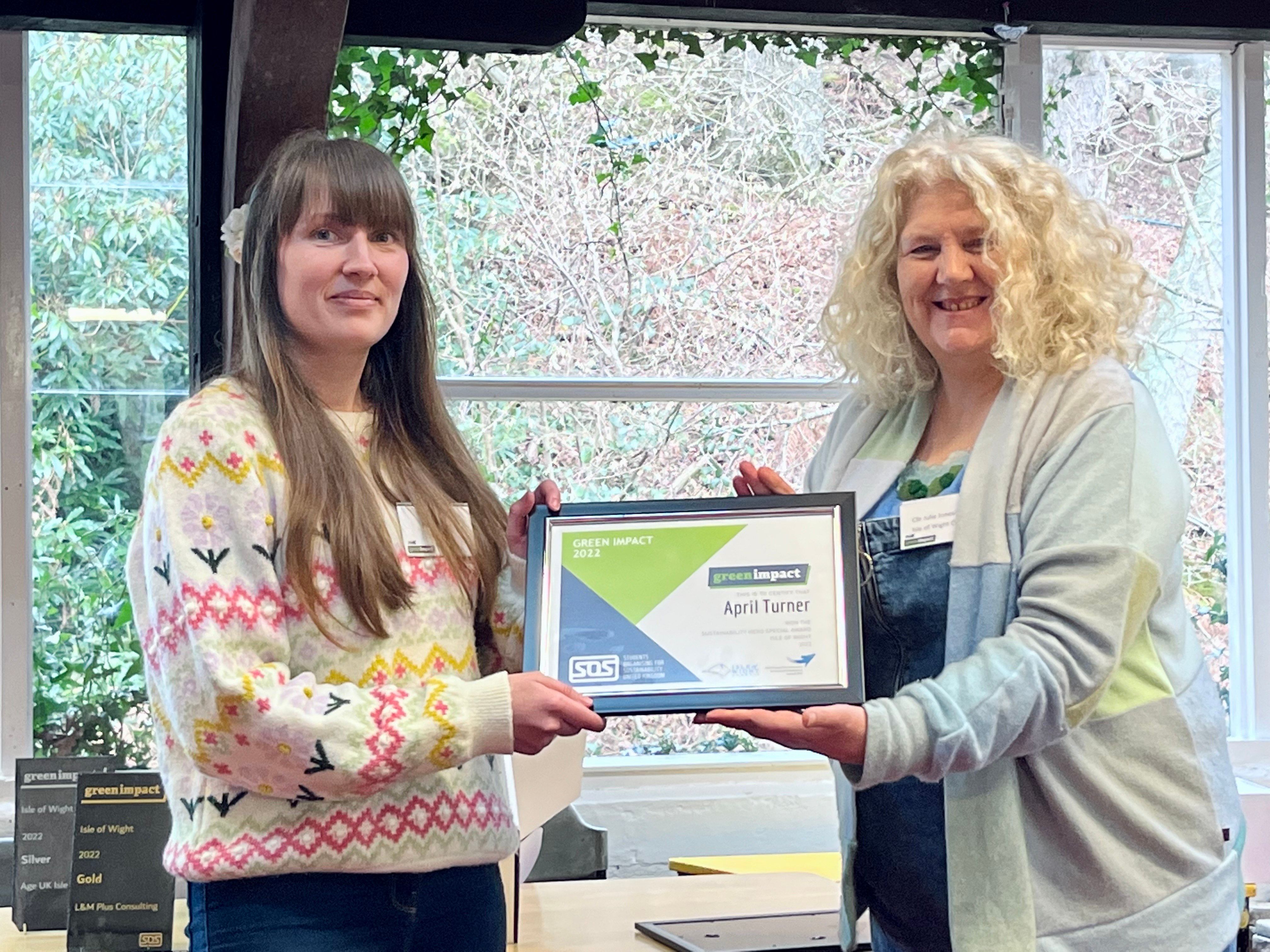 April receiving the Sustainability Hero award from Julie Jones-Evans