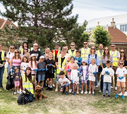 Families, children, and volunteers gather in East Cowes for NOSY’s Rubbish Networking clean-up, promoting community pride and environmental action.