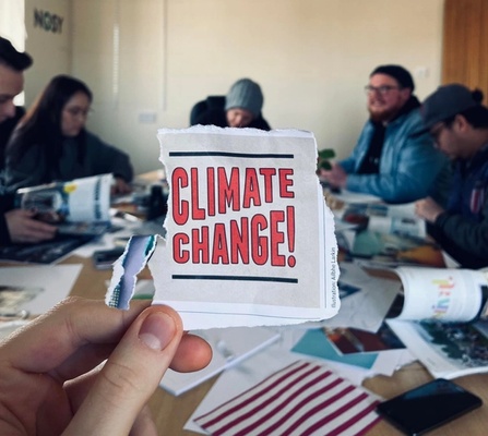 Paper pullout with headline "Climate Change"