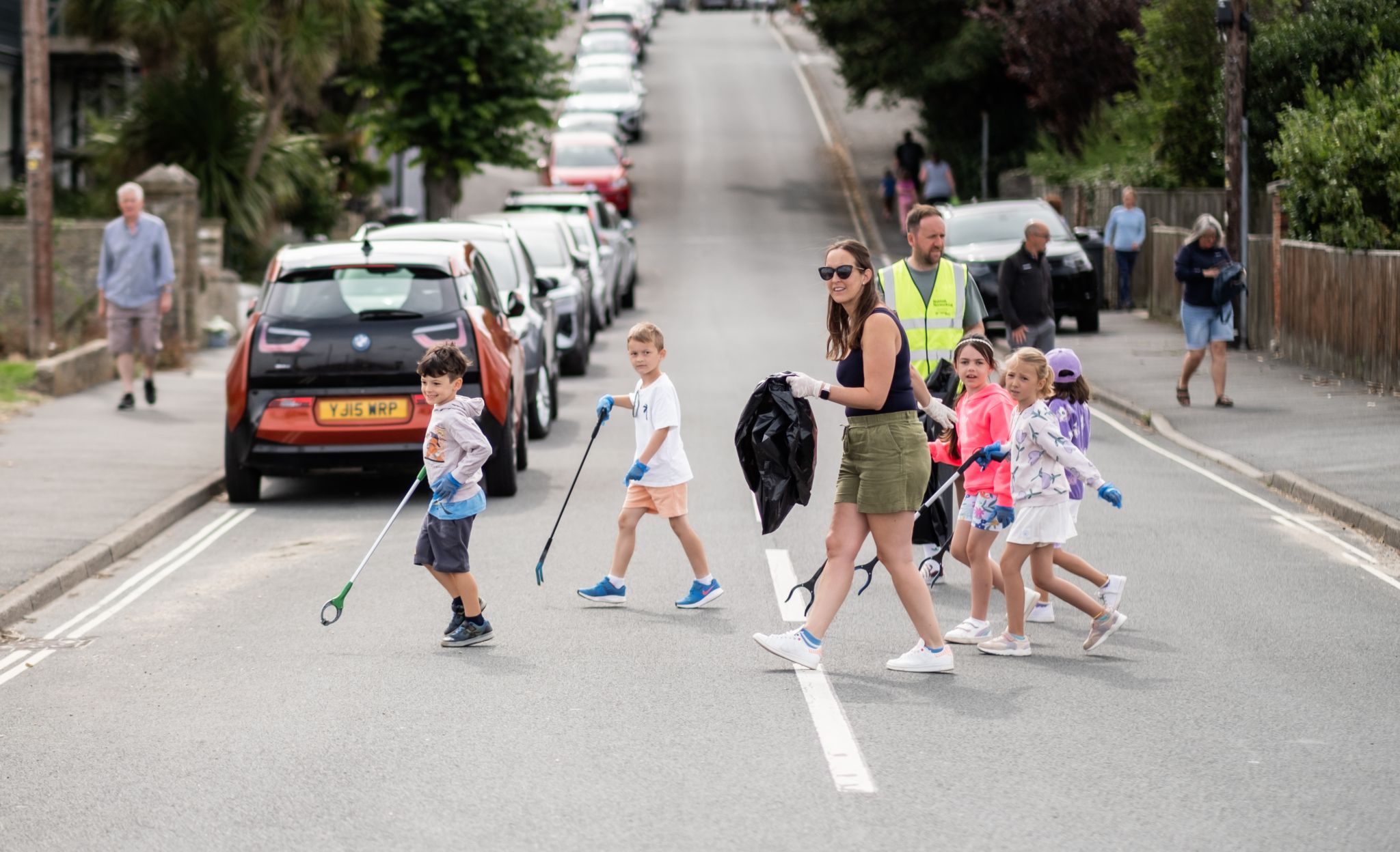 Families, children, and local residents take part in NOSY Creative Agency’s Rubbish Networking event in East Cowes, uniting to reduce litter and build community pride.