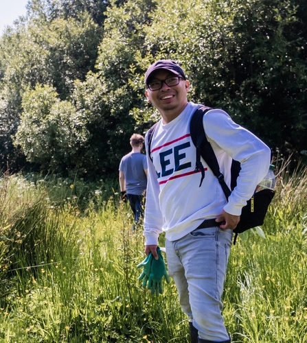1% for the Planet logo next to a photo of a caterpillar