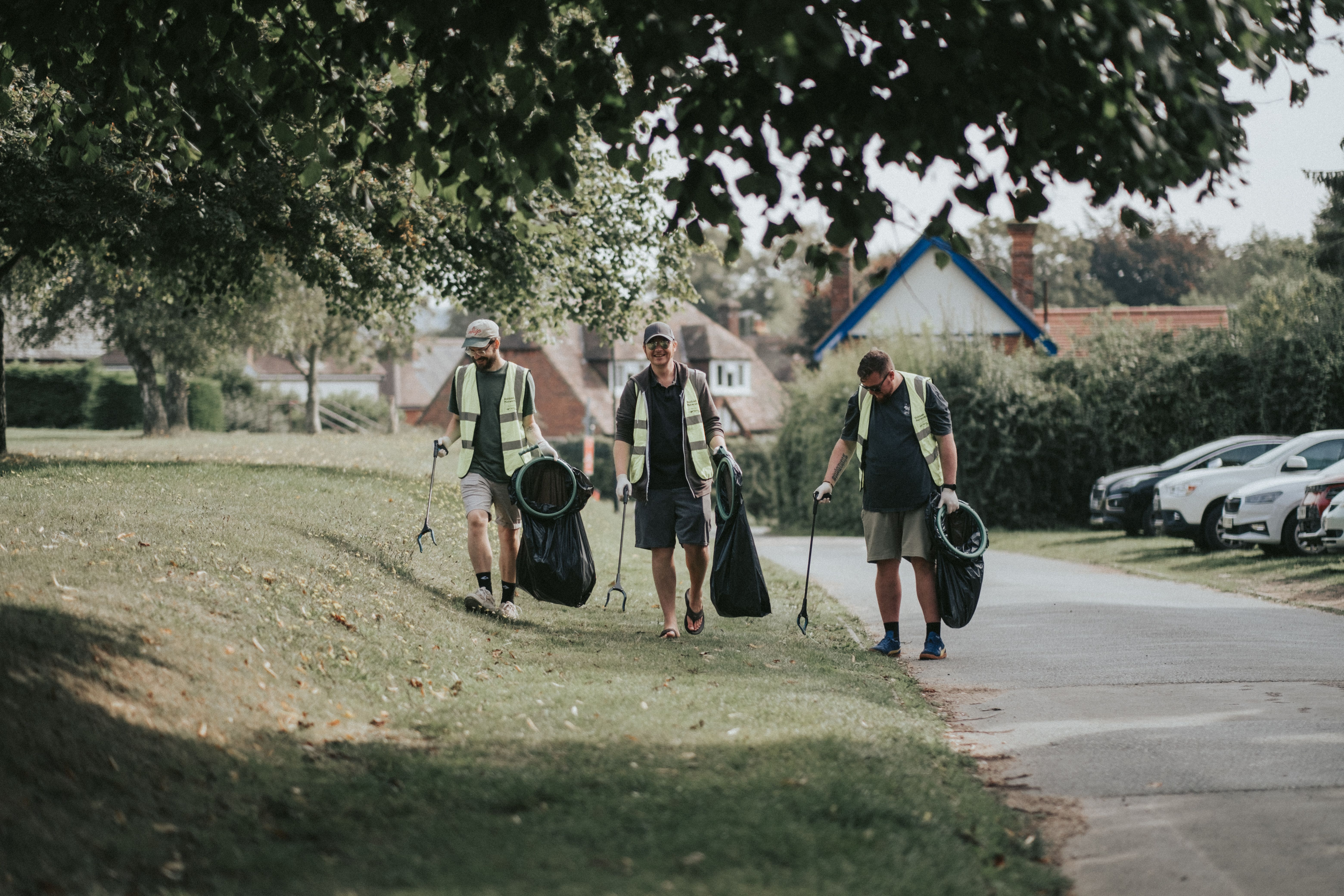 Richard Brimson, Aaron Bentley, Scott Bennett of NOSY chat while picking up litter