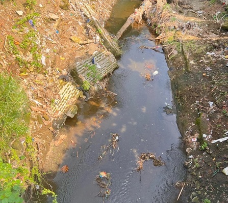 A river in the Philippines with various rubbish & plastic pollution