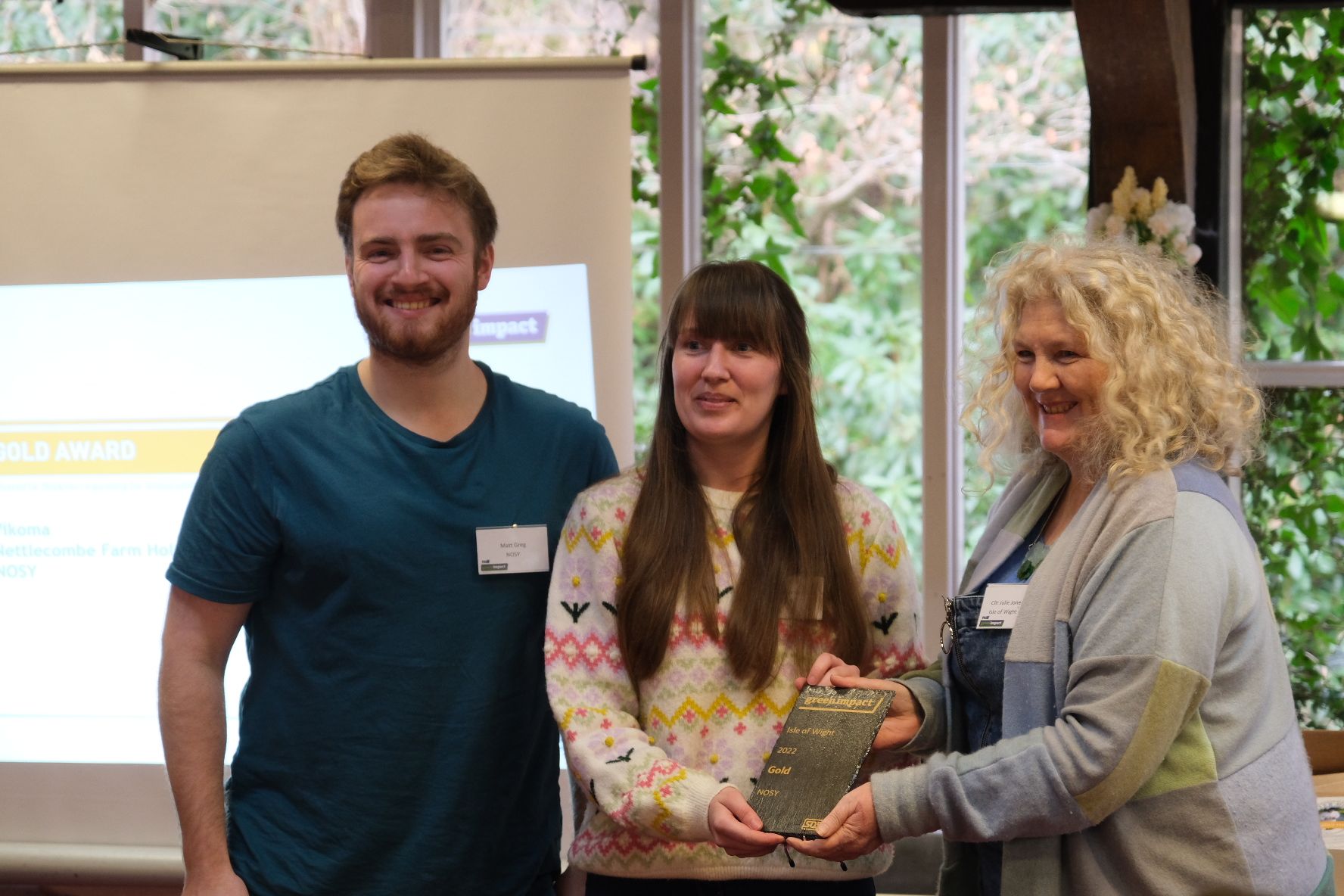 Matt Greg and April Turner receiving the Green Impact Gold Award