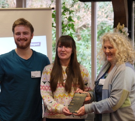 Matt Greg and April Turner receiving the Green Impact Gold Award