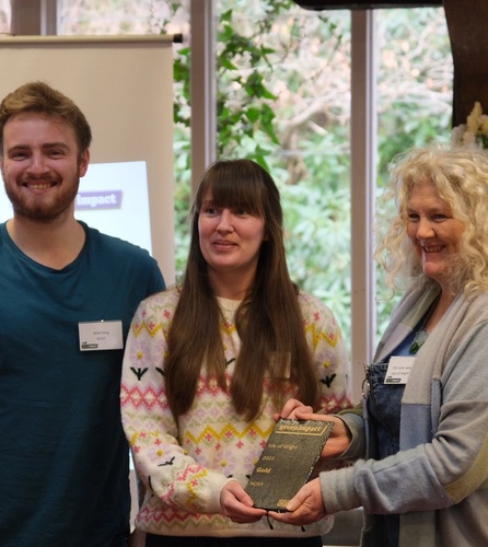 Matt Greg and April Turner receiving the Green Impact Gold Award
