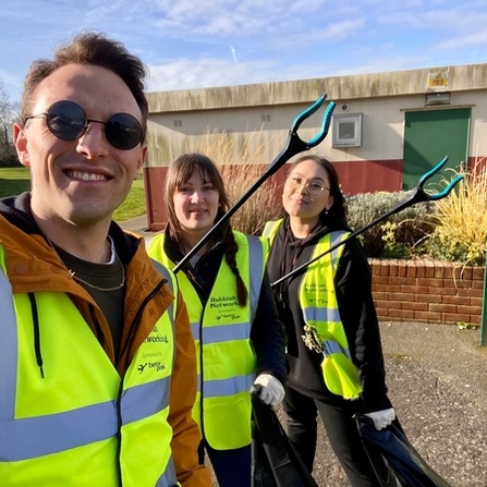 Henry, April and Georgina hold up litter pickers, ready for Rubbish Networking