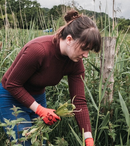 NOSY team member volunteering in nature, supporting environmental sustainability