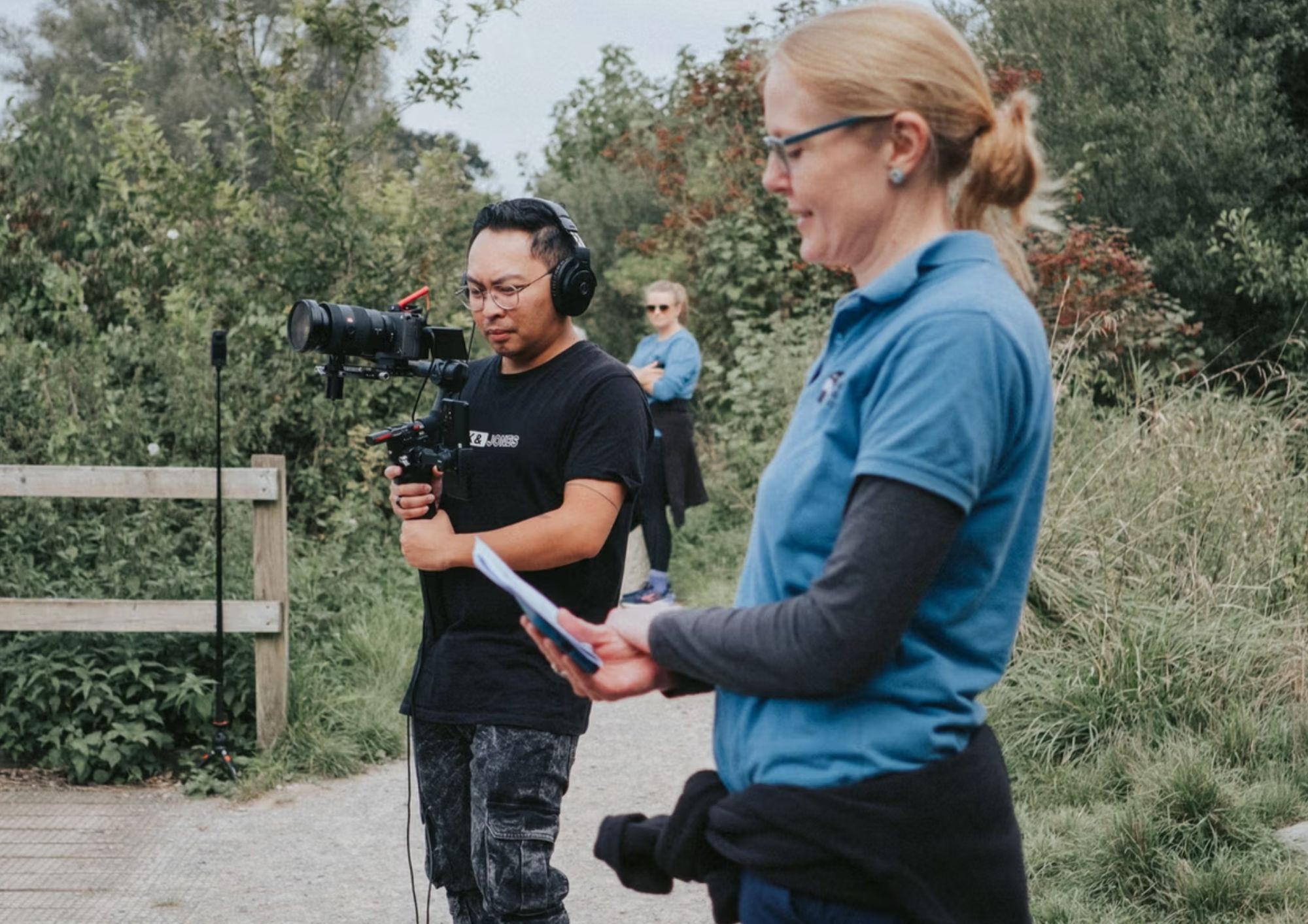 NOSY team filming and supporting a community project outdoors